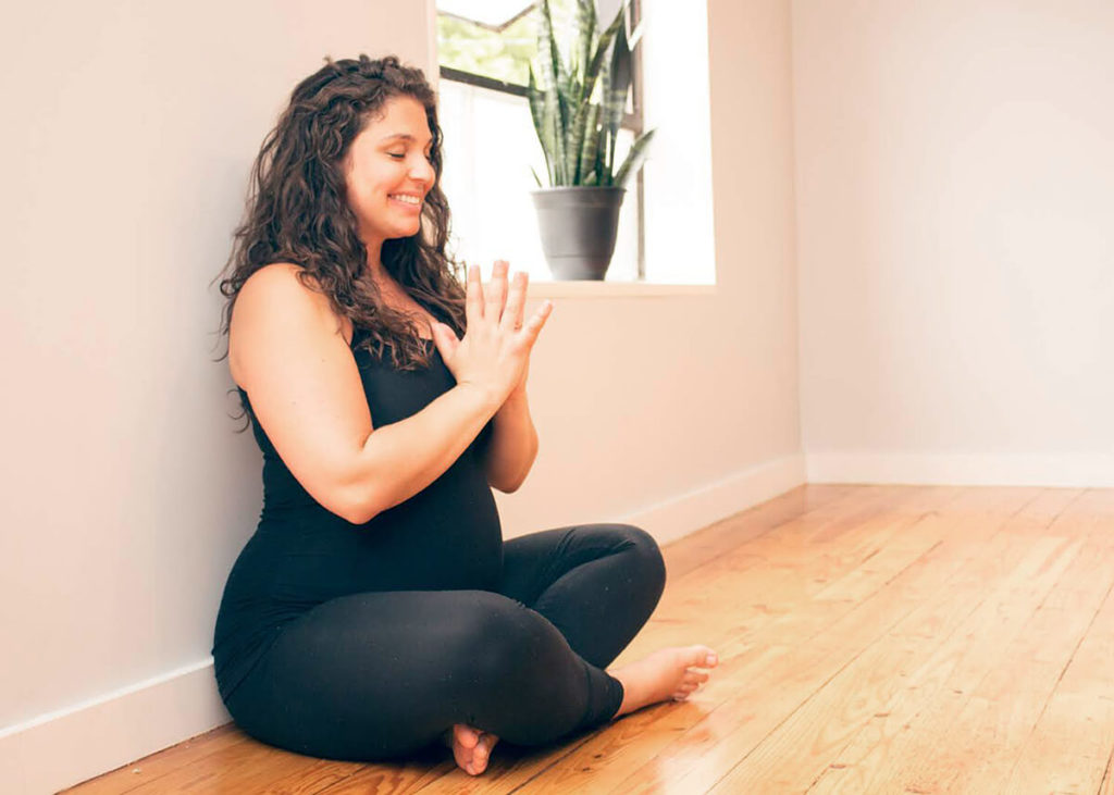 Expectant mom practicing yoga in Columbus, Ohio