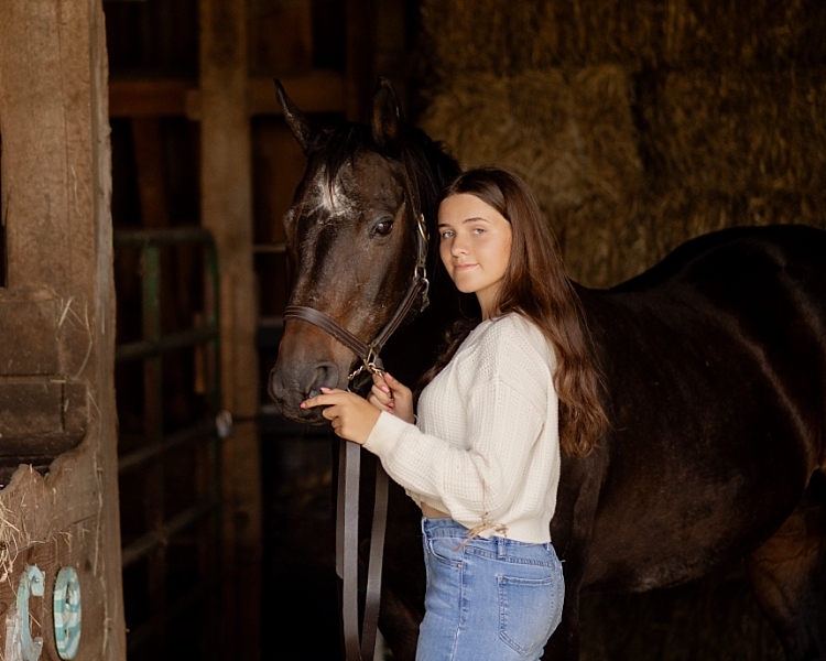 teen in horse barn in Ohio