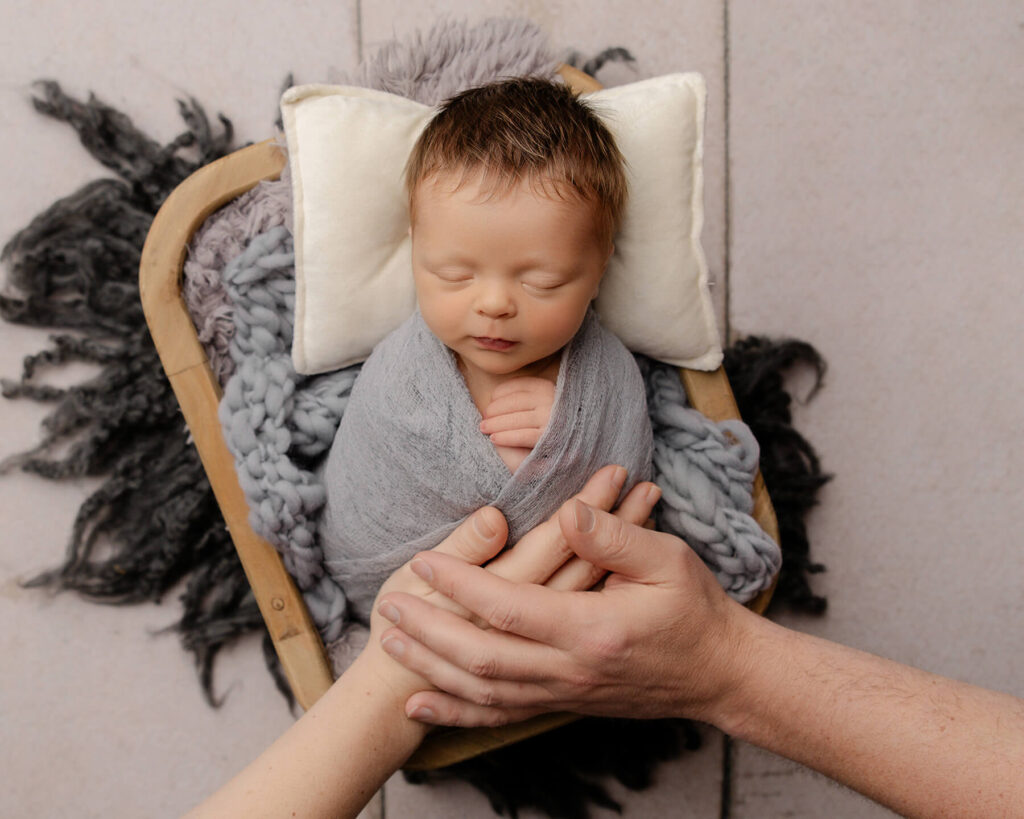 Newborn Photography in Columbus Ohio parent hands on new baby